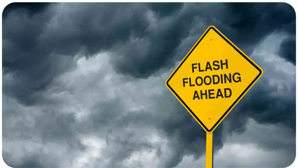 a yellow sign with the words flash flooding ahead